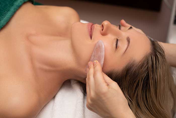 Woman getting facial treatment